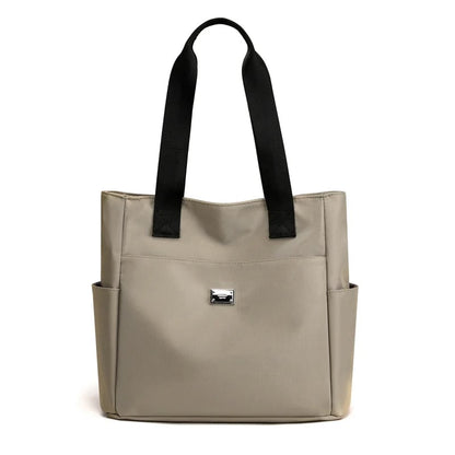 🔥Vattenavvisande axelväska i nylon med flera fickor och stor kapacitet👜